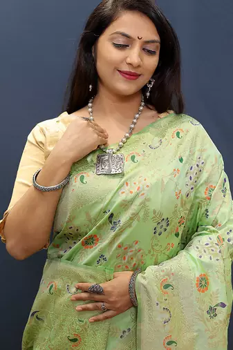 Mint green banarasi silk blend saree with zari floral weaving