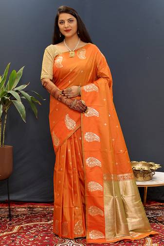 Orange silk blend banarasi saree with golden zari buti and border