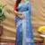 Blue silk blend banarasi saree with silver zari border and peacock pallu