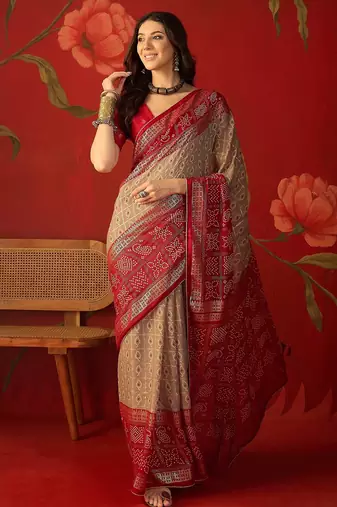 Beige georgette bandhni printed saree with unstitched blouse piece.
