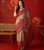 Beige georgette bandhni printed saree with unstitched blouse piece.