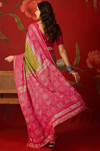 Green georgette bandhni printed saree with unstitched blouse piece.