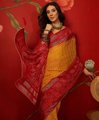 Mustard georgette bandhni printed saree with unstitched blouse piece. 1