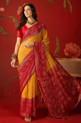 Mustard georgette bandhni printed saree with unstitched blouse piece.