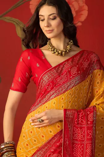 Mustard georgette bandhni printed saree with unstitched blouse piece.