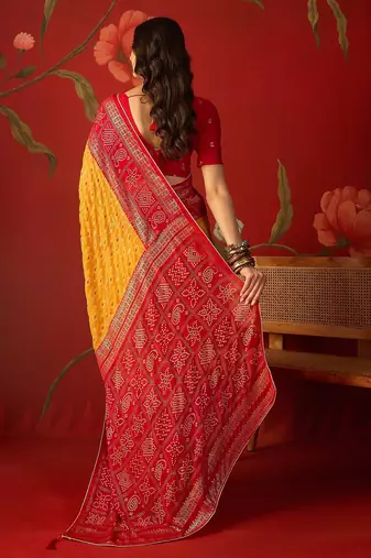 Mustard georgette bandhni printed saree with unstitched blouse piece.