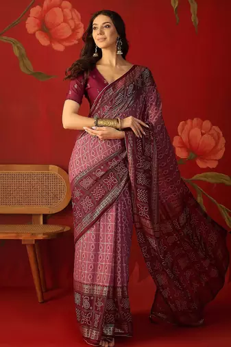 Onion georgette bandhni printed saree with unstitched blouse piece.