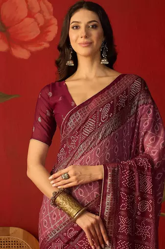 Onion georgette bandhni printed saree with unstitched blouse piece.
