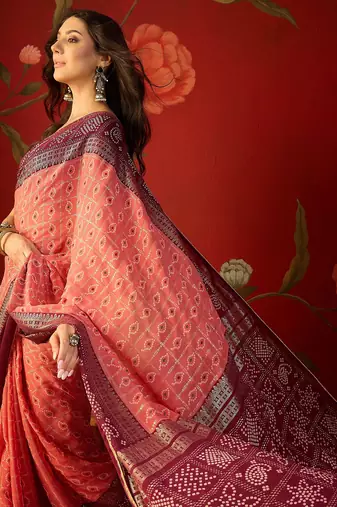 Pink georgette bandhni printed saree with unstitched blouse piece.