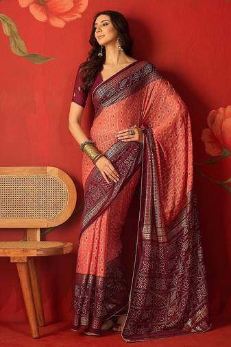 Pink georgette bandhni printed saree with unstitched blouse piece.