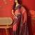 Pink georgette bandhni printed saree with unstitched blouse piece.