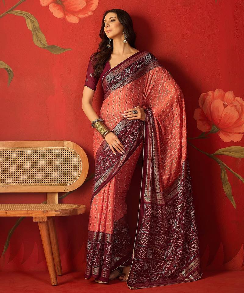 Pink georgette bandhni printed saree with unstitched blouse piece.