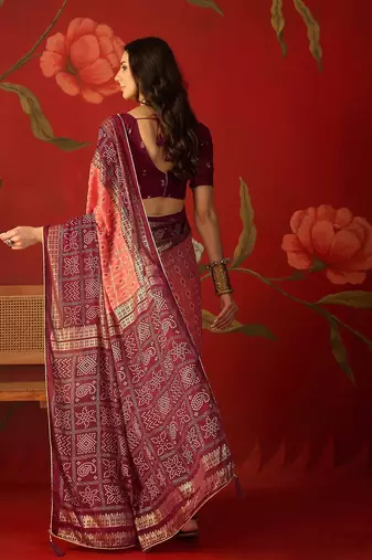 Pink georgette bandhni printed saree with unstitched blouse piece.