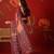Pink georgette bandhni printed saree with unstitched blouse piece.