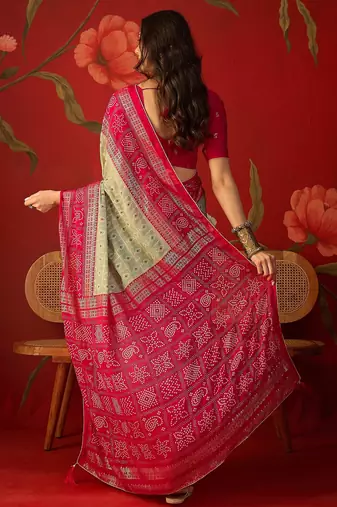 Pista georgette bandhni printed saree with unstitched blouse piece.