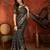 Black silk cotton bandhni saree with unstitched blouse piece.