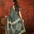 Green silk cotton bandhni saree with unstitched blouse piece.