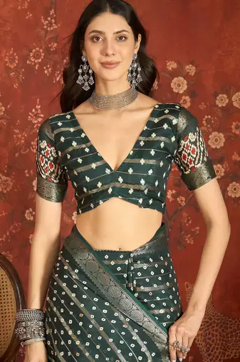 Green silk cotton bandhni saree with unstitched blouse piece.