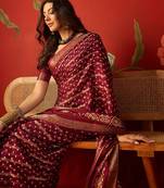 Maroon silk cotton bandhni saree with unstitched blouse piece.
