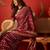Maroon silk cotton bandhni saree with unstitched blouse piece.
