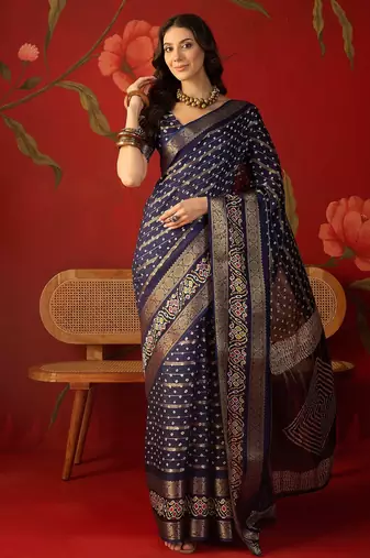 Navy blue silk cotton bandhni saree with unstitched blouse piece.