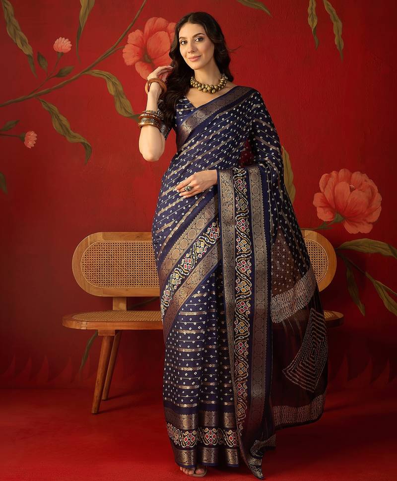 Navy blue silk cotton bandhni saree with unstitched blouse piece.