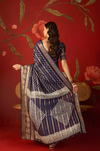 Navy blue silk cotton bandhni saree with unstitched blouse piece.