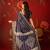 Navy blue silk cotton bandhni saree with unstitched blouse piece.