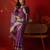 Purple silk cotton bandhni saree with unstitched blouse piece.