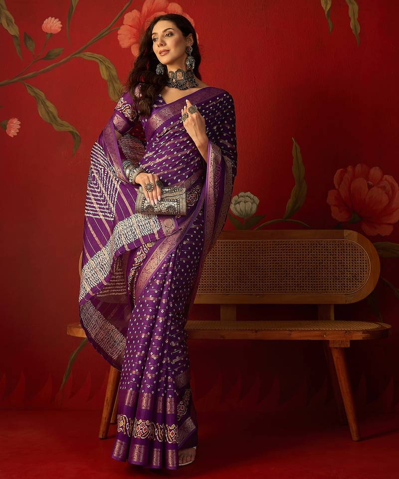 Purple silk cotton bandhni saree with unstitched blouse piece.