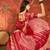 Red silk cotton bandhni saree with unstitched blouse piece.