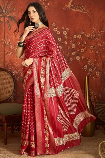 Red silk cotton bandhni saree with unstitched blouse piece.