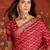 Red silk cotton bandhni saree with unstitched blouse piece.