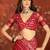 Red silk cotton bandhni saree with unstitched blouse piece.