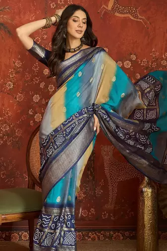 Blue silk cotton bandhni saree with unstitched blouse piece.