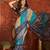 Blue silk cotton bandhni saree with unstitched blouse piece.