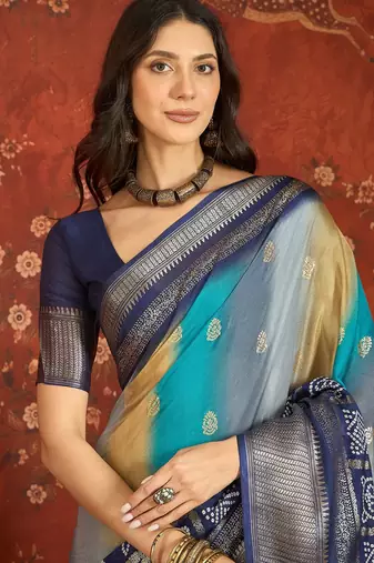 Blue silk cotton bandhni saree with unstitched blouse piece.