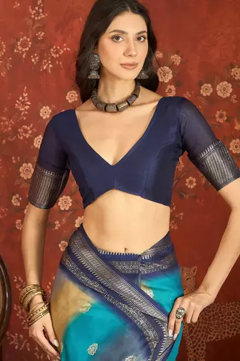 Blue silk cotton bandhni saree with unstitched blouse piece.