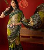 Green silk cotton bandhni saree with unstitched blouse piece.