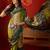 Green silk cotton bandhni saree with unstitched blouse piece.