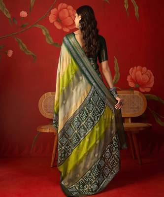 Green silk cotton bandhni saree with unstitched blouse piece. 3