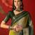 Green silk cotton bandhni saree with unstitched blouse piece.