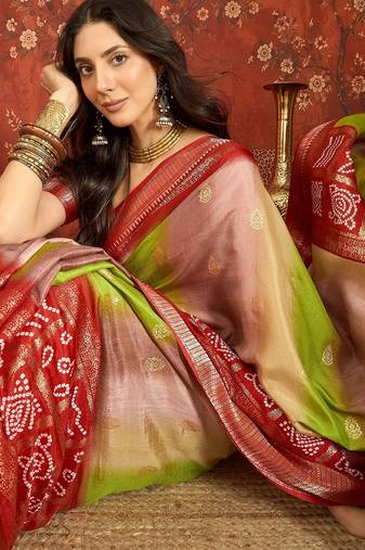 Red silk cotton bandhni saree with unstitched blouse piece.