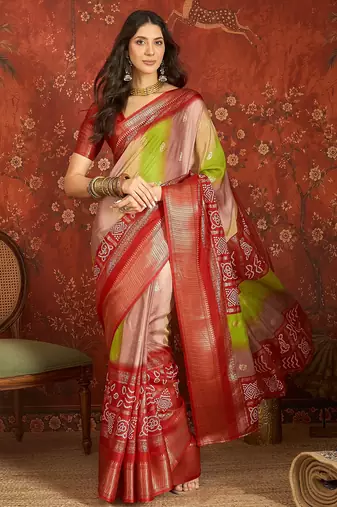 Red silk cotton bandhni saree with unstitched blouse piece.