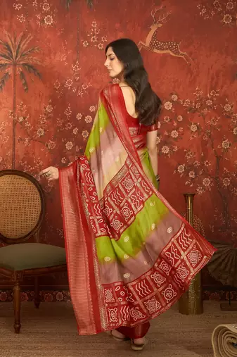 Red silk cotton bandhni saree with unstitched blouse piece.
