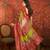 Red silk cotton bandhni saree with unstitched blouse piece.
