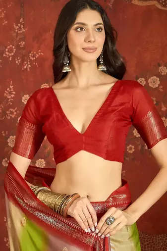Red silk cotton bandhni saree with unstitched blouse piece.