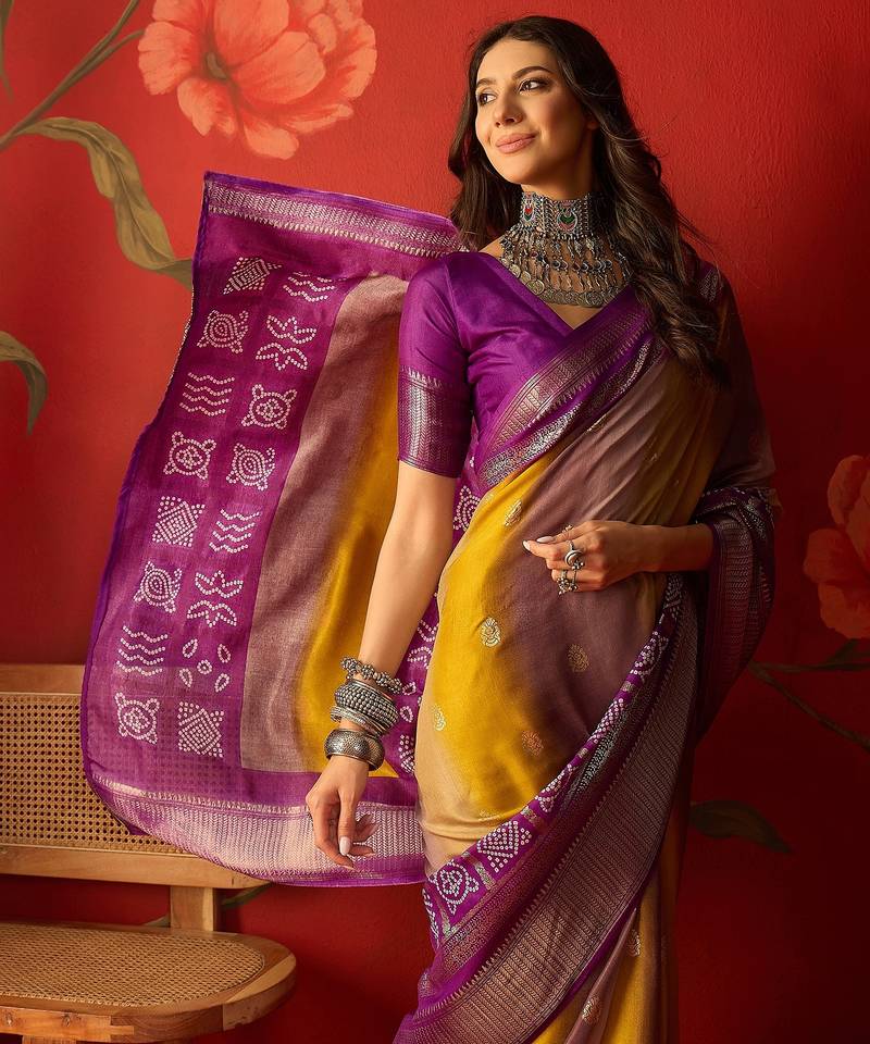 Wine silk cotton bandhni saree with unstitched blouse piece.