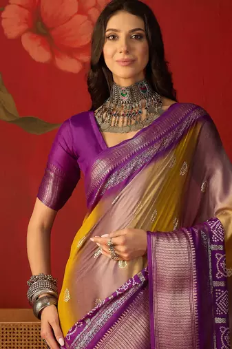 Wine silk cotton bandhni saree with unstitched blouse piece.