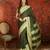 Green chiffon zari checks saree with unstitched blouse piece.